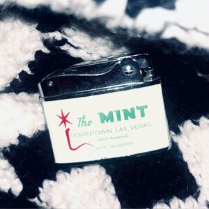 UNUSED 1960s POCKET LIGHTER FROM THE MINT HOTEL IN LAS VEGAS, BABY… VEGAS.